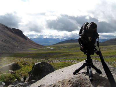 Spotting scope on top of a boulder