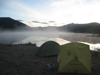 Tents in front of foggy Black Lake